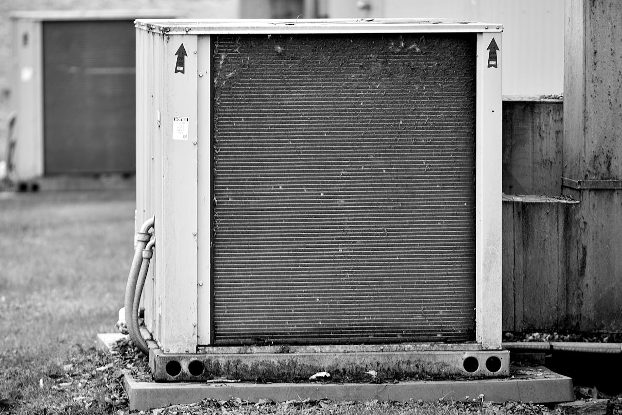 services-03 Close-up of an industrial HVAC unit outdoors, showcasing its metal texture.